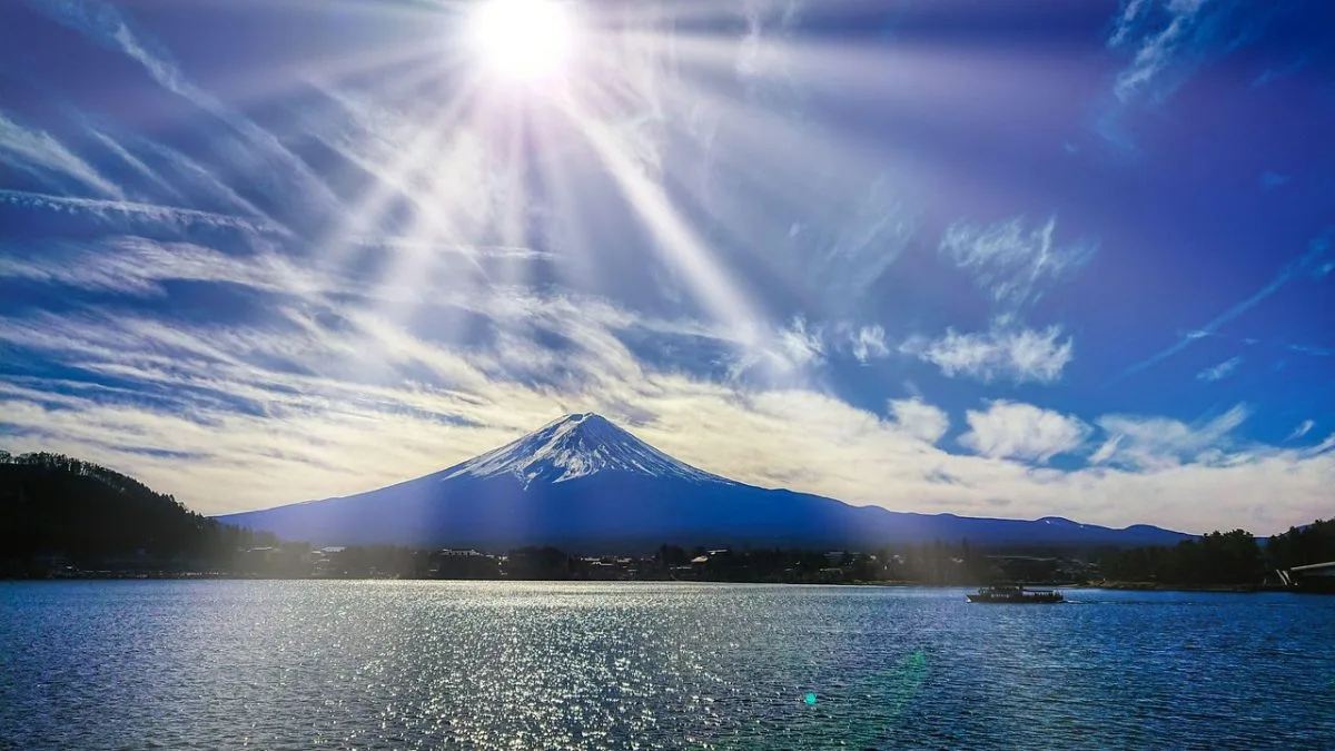 Breathtaking scenic view of Mount Fuji overlooking a vibrant landscape, showcasing the natural beauty and travel experiences of the region.